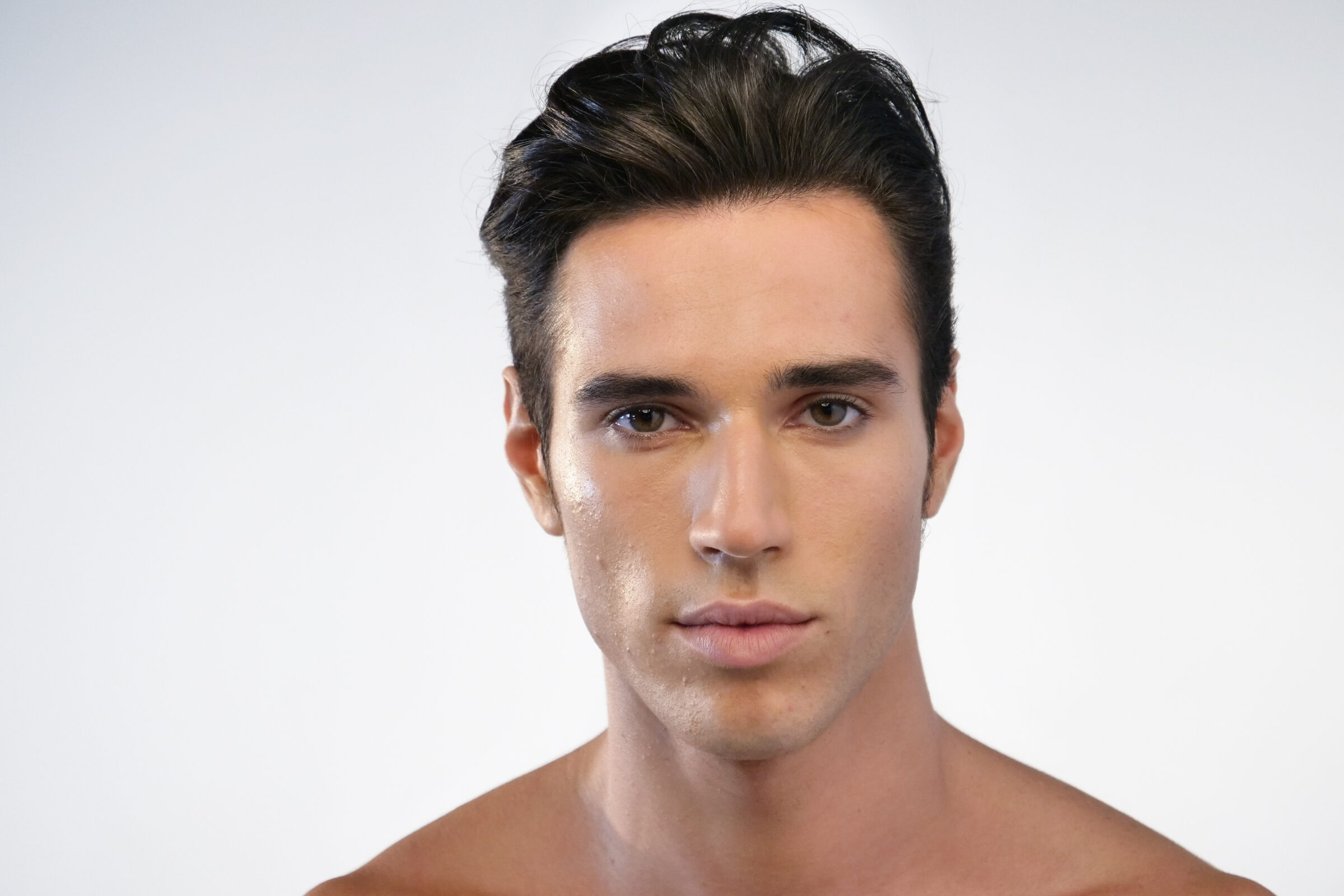 An image of a handsome brunette man's face.